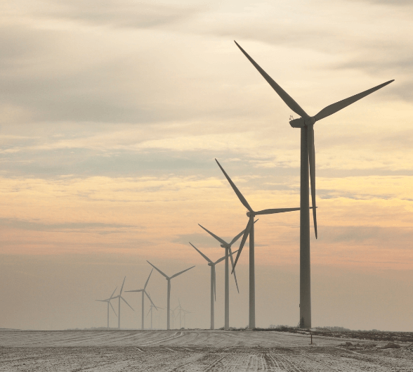 Onshore wind turbines at sunset